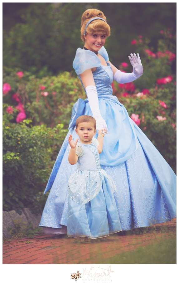 a photography portrait of a little girl battling cancer being surprised with real princesses and a tea party in the roger williams park rose garden with rhode island photographers of massart photography RI, CT, MA