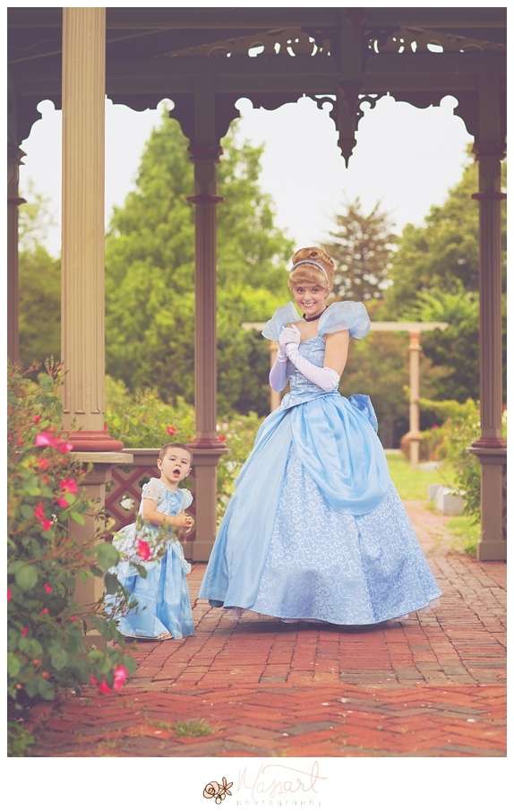 a photography portrait of a little girl battling cancer being surprised with real princesses and a tea party in the roger williams park rose garden with rhode island photographers of massart photography RI, CT, MA