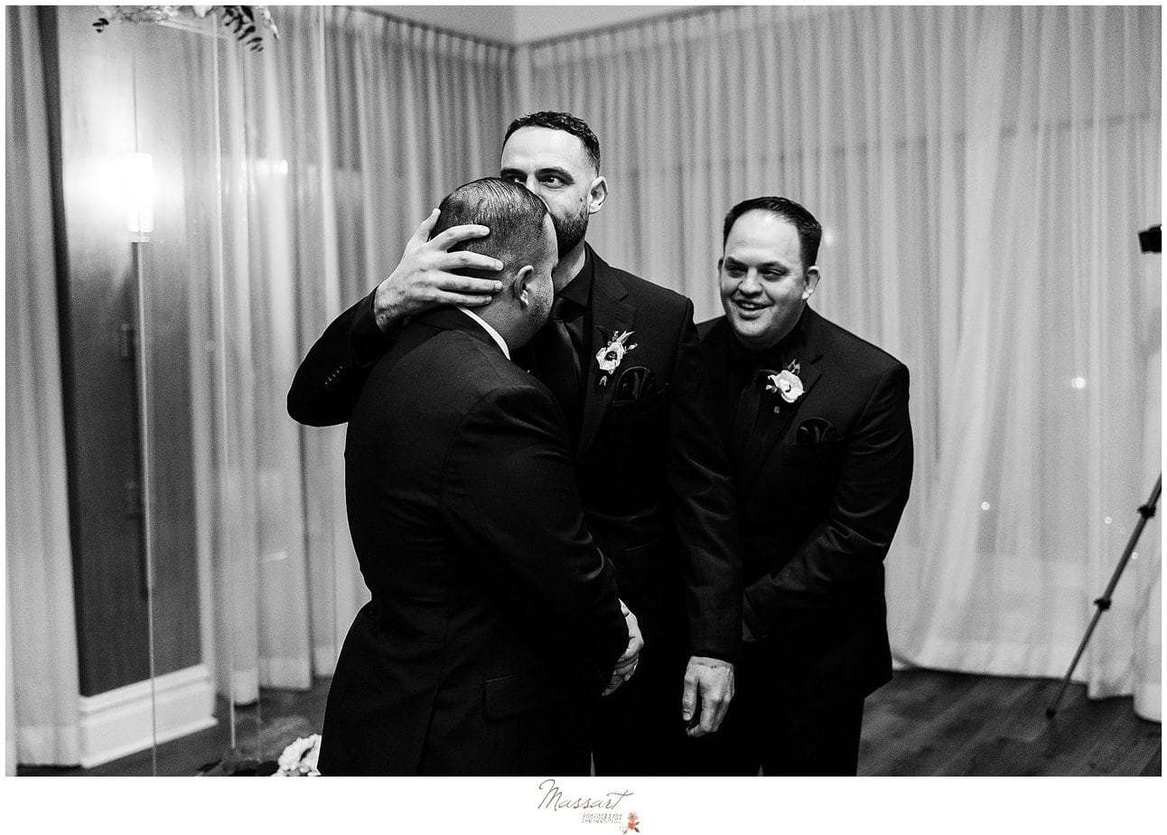 A touching moment between the groom and his best man before the bride walks down the aisle in RI