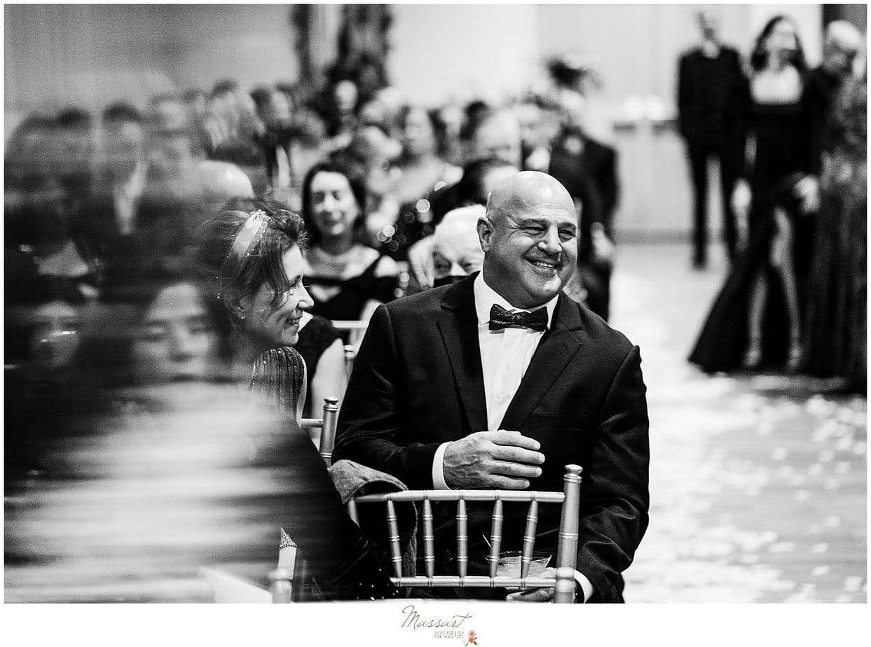 A touching and candid moment captured of the guests at a Wyndham atlantic resort wedding in RI by Massart Photography