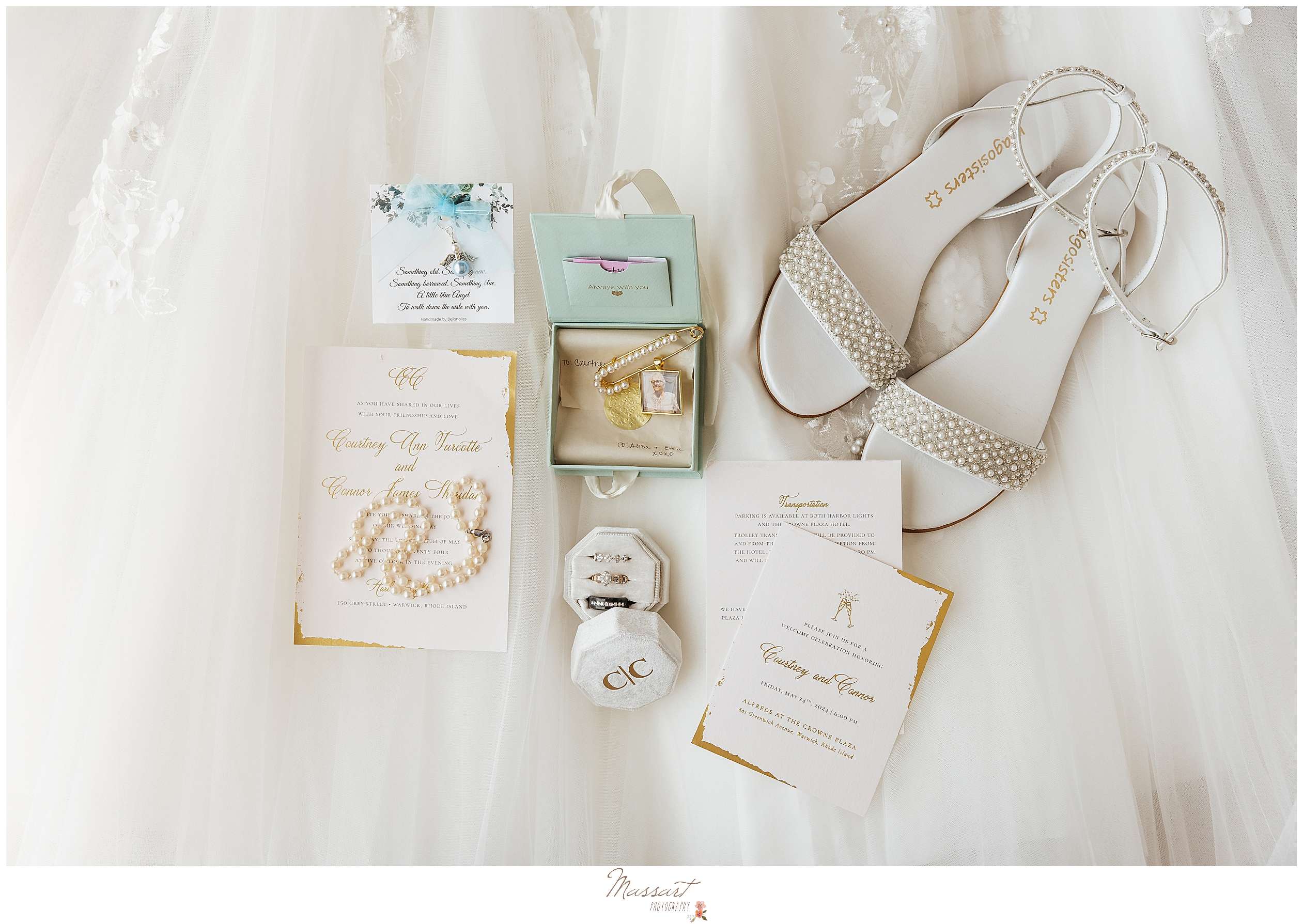 bride's pearl necklace and shoes with pearl accents on wedding dress with invitation suite