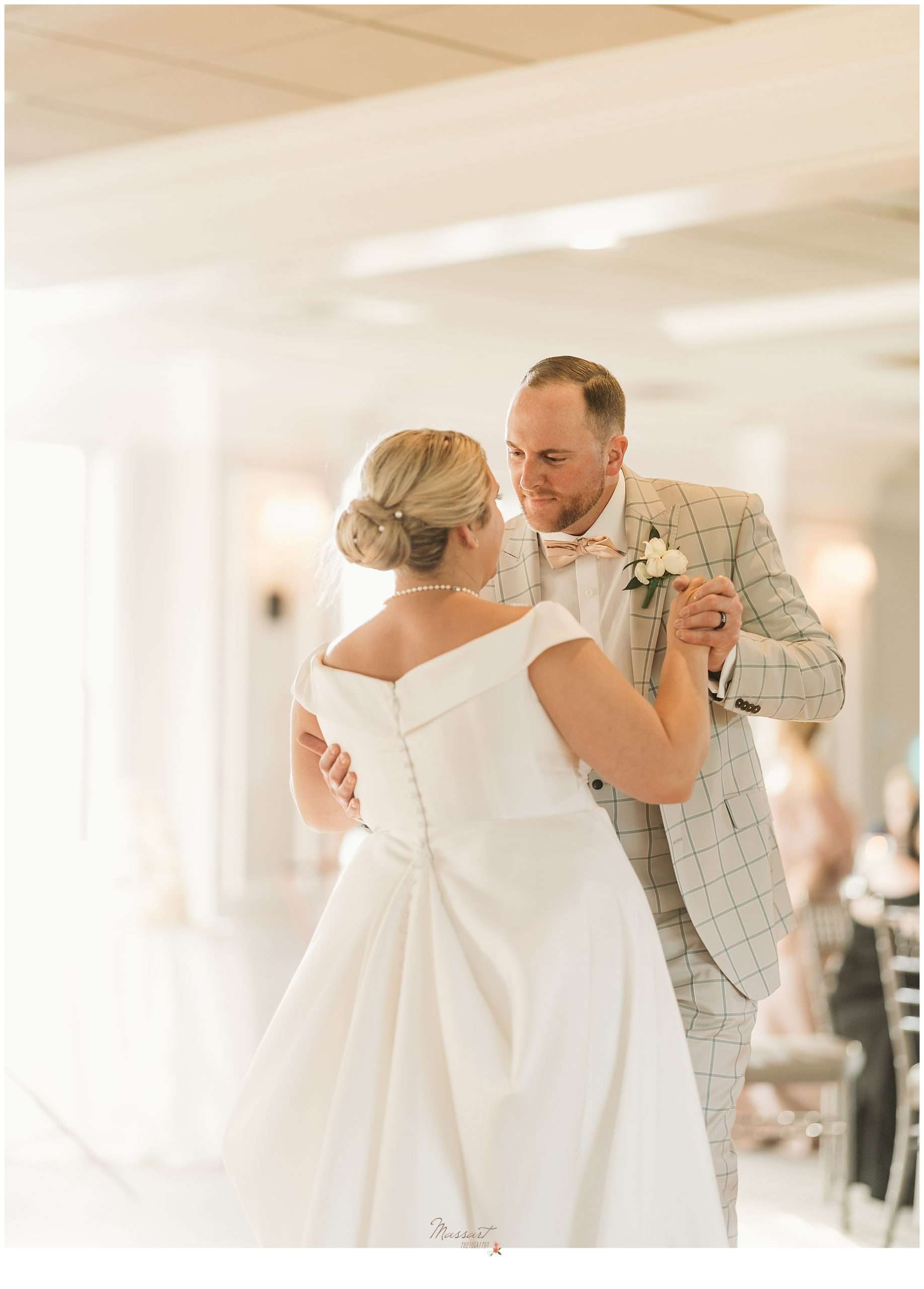 bride and groom dance in ballroom at Harbor Lights