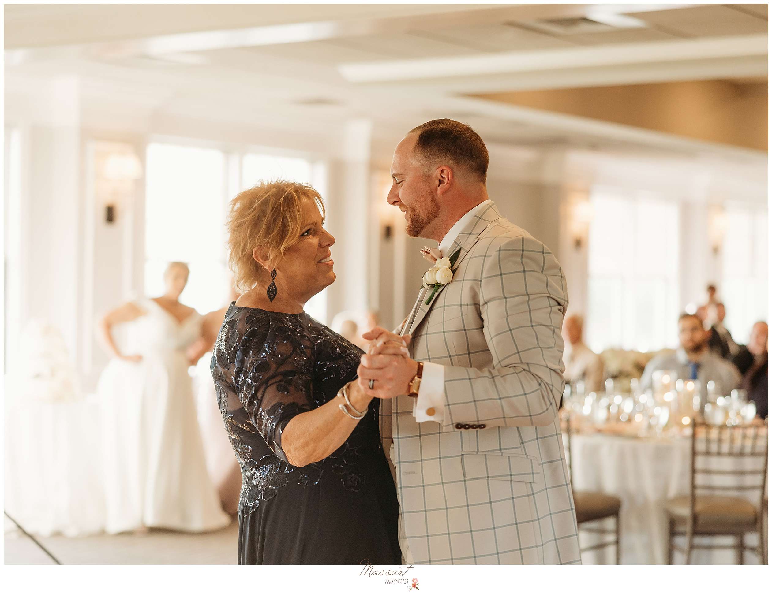 groom dances with mother during Harbor Lights wedding reception in Rhode Island